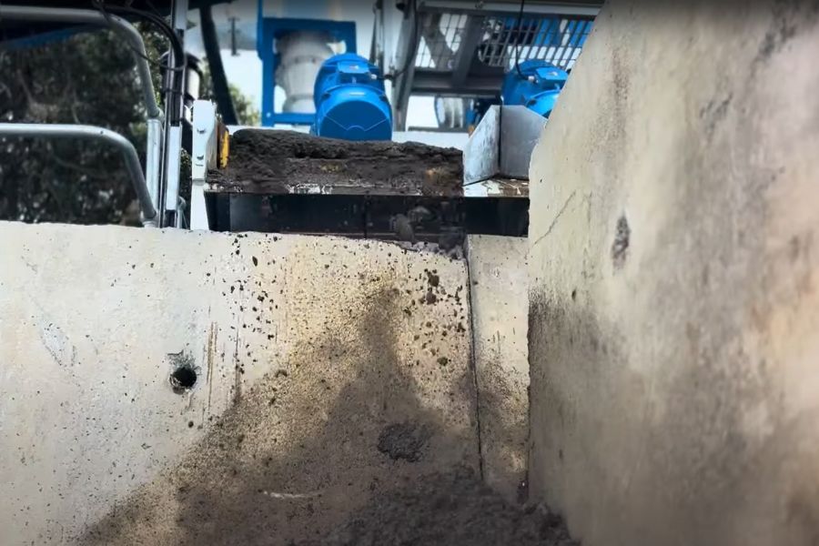 Construction slurry being processed on equipment at a resource recovery facility